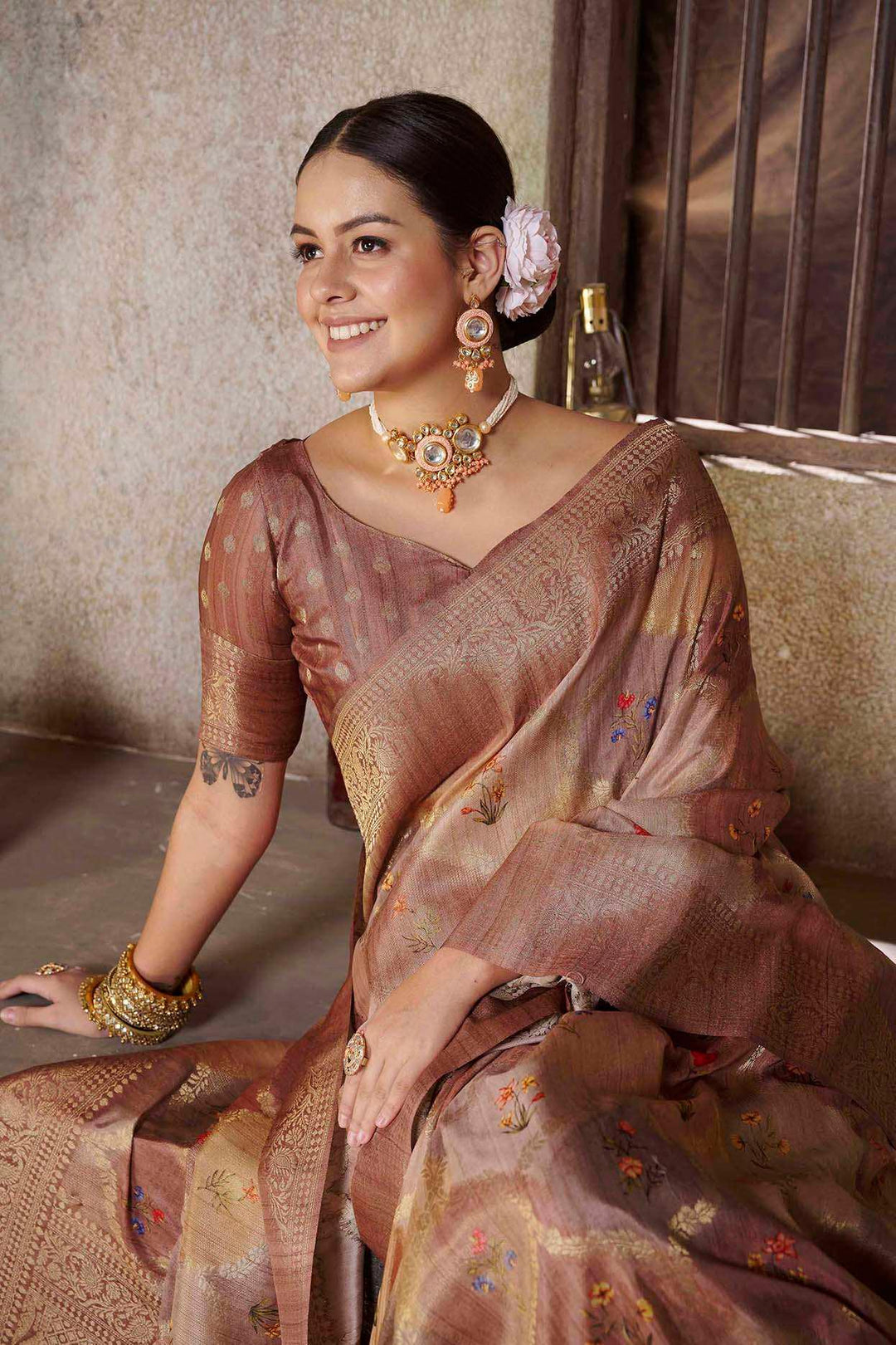 woman sitting in Tusser Brown Savannah saree.