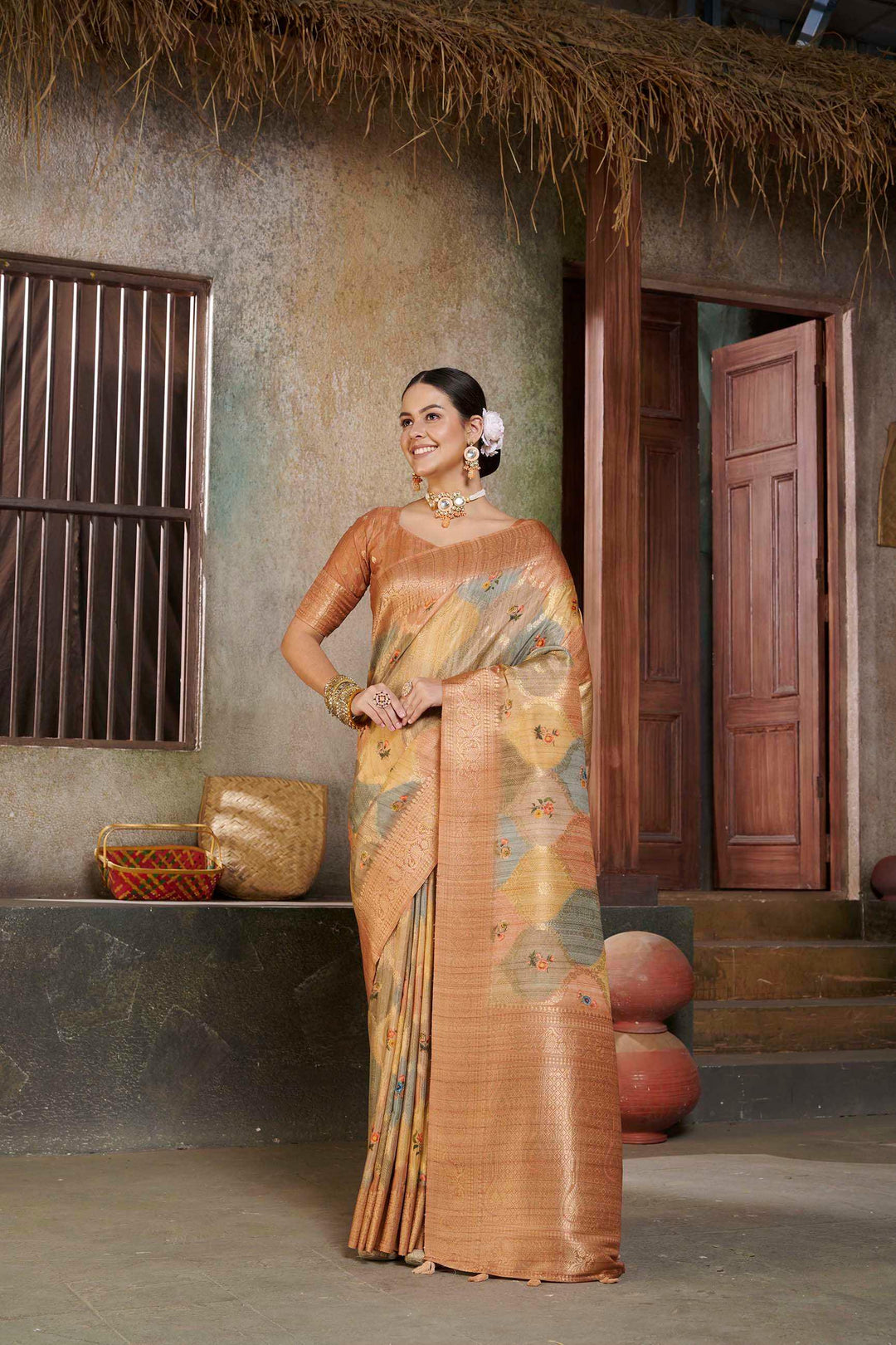 woman standing in Orange Savannah Saree.