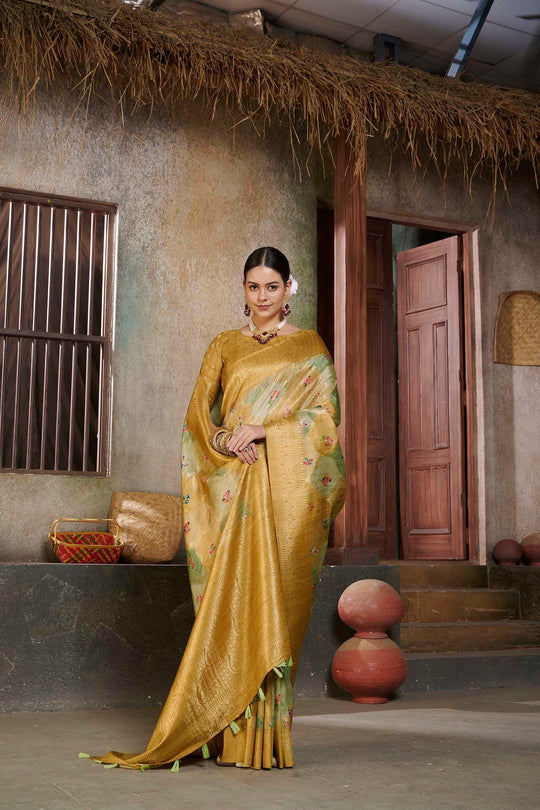 woman standing in Metallic Yellow Savannah Saree.