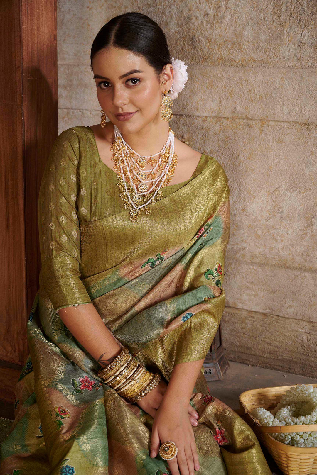 woman sitting in Mehndi Savannah Saree.