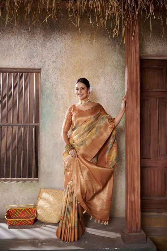 woman standing and smiling  in Orange Savannah Saree.