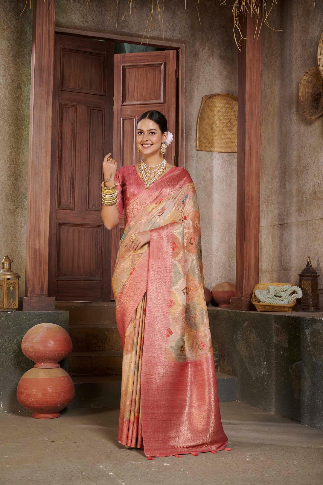 woman standing in Pink Jcrd Savannah Saree.