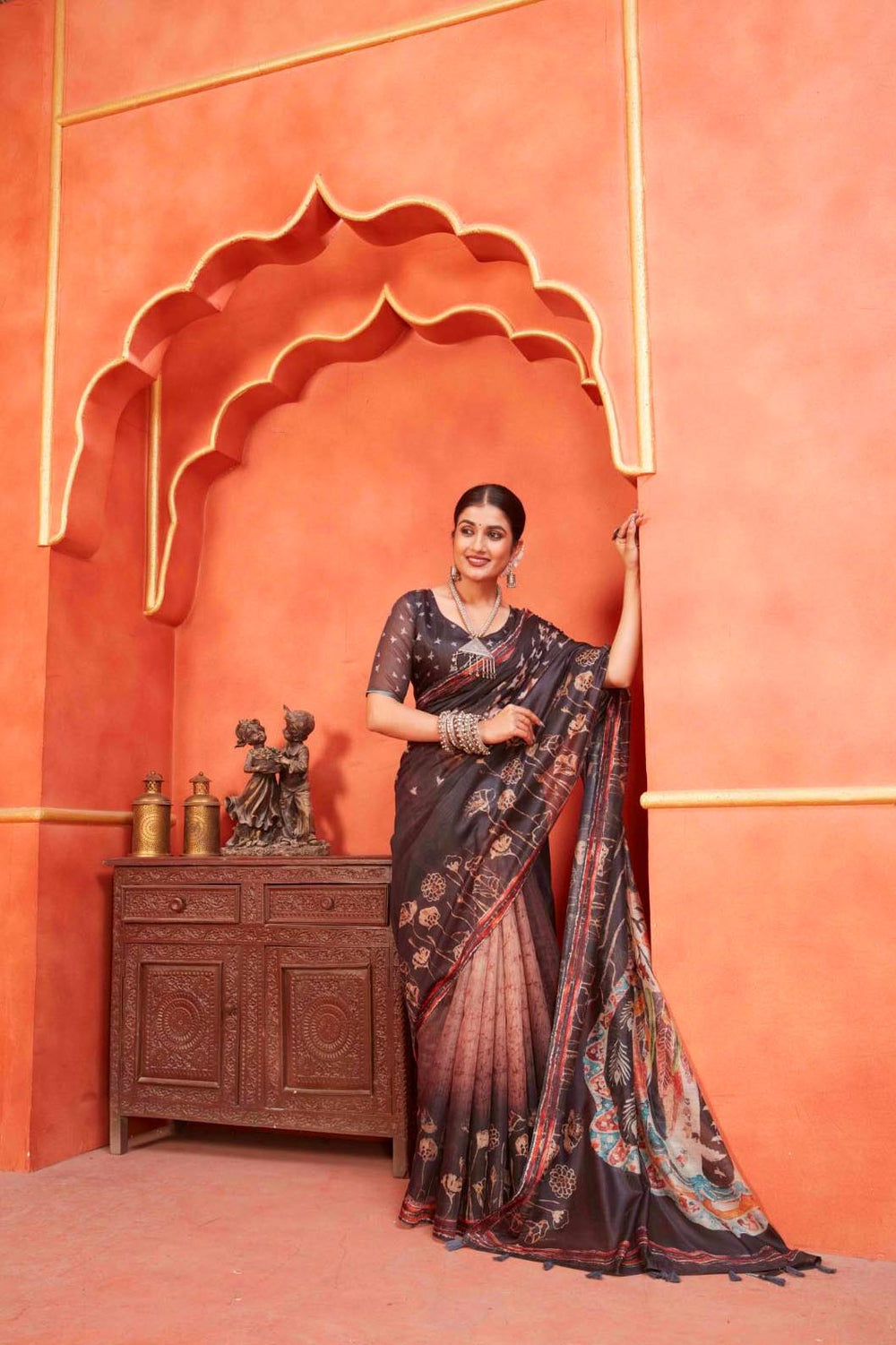 woman standing in Dark Brown Pichwai Chanderi Saree.