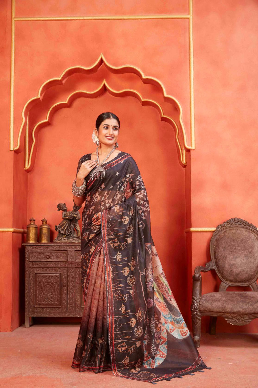 woman standing in Dark Brown Pichwai Chanderi Saree.