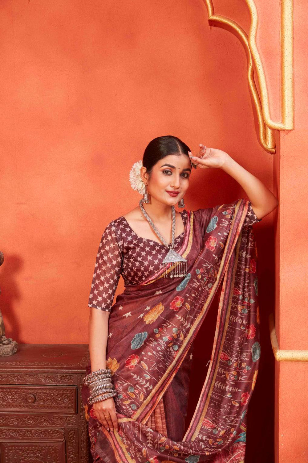 woman standing in Maroon Designer Pichwai Chanderi Saree.