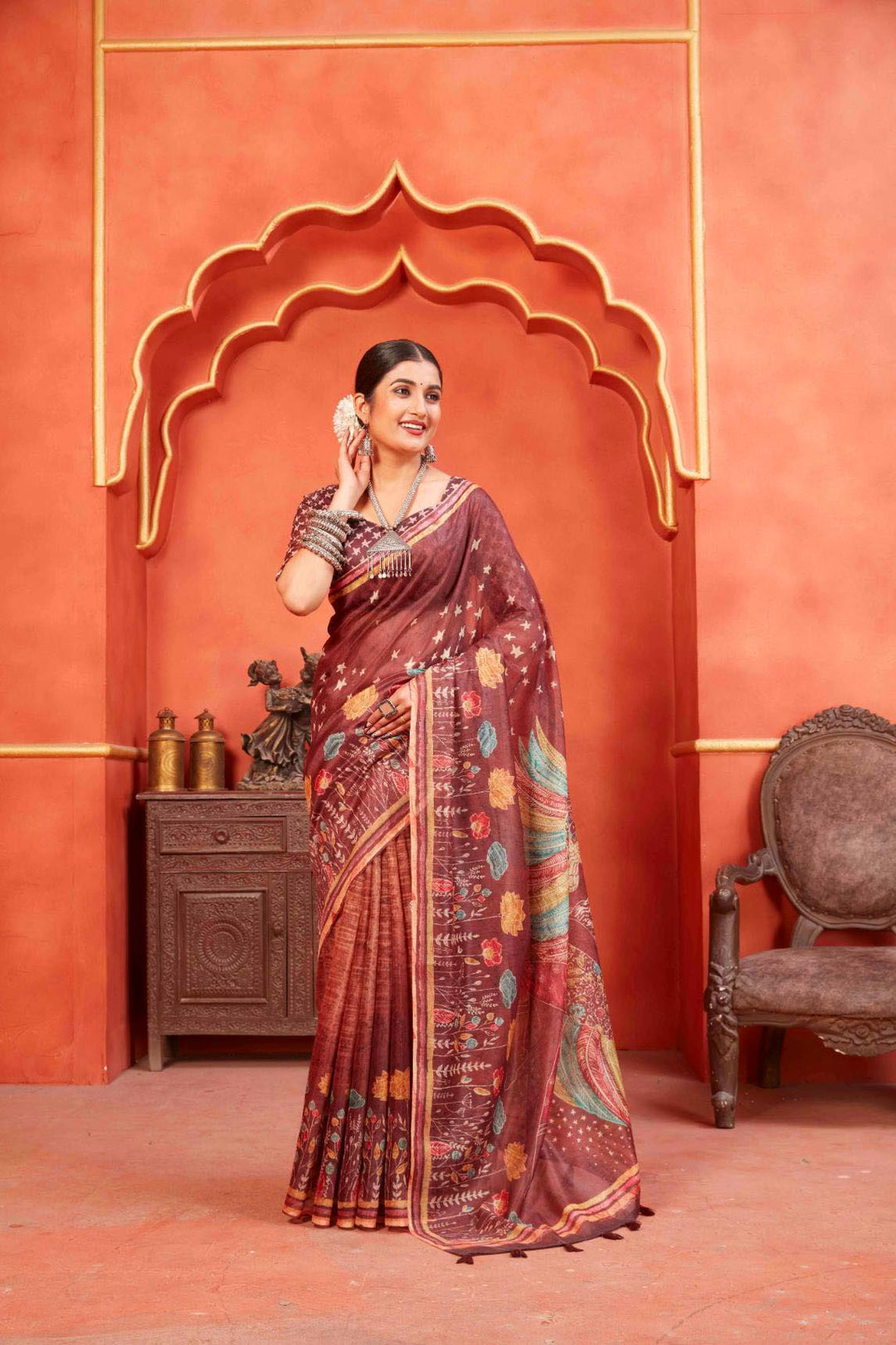 woman standing in Maroon Designer Pichwai Chanderi Saree.