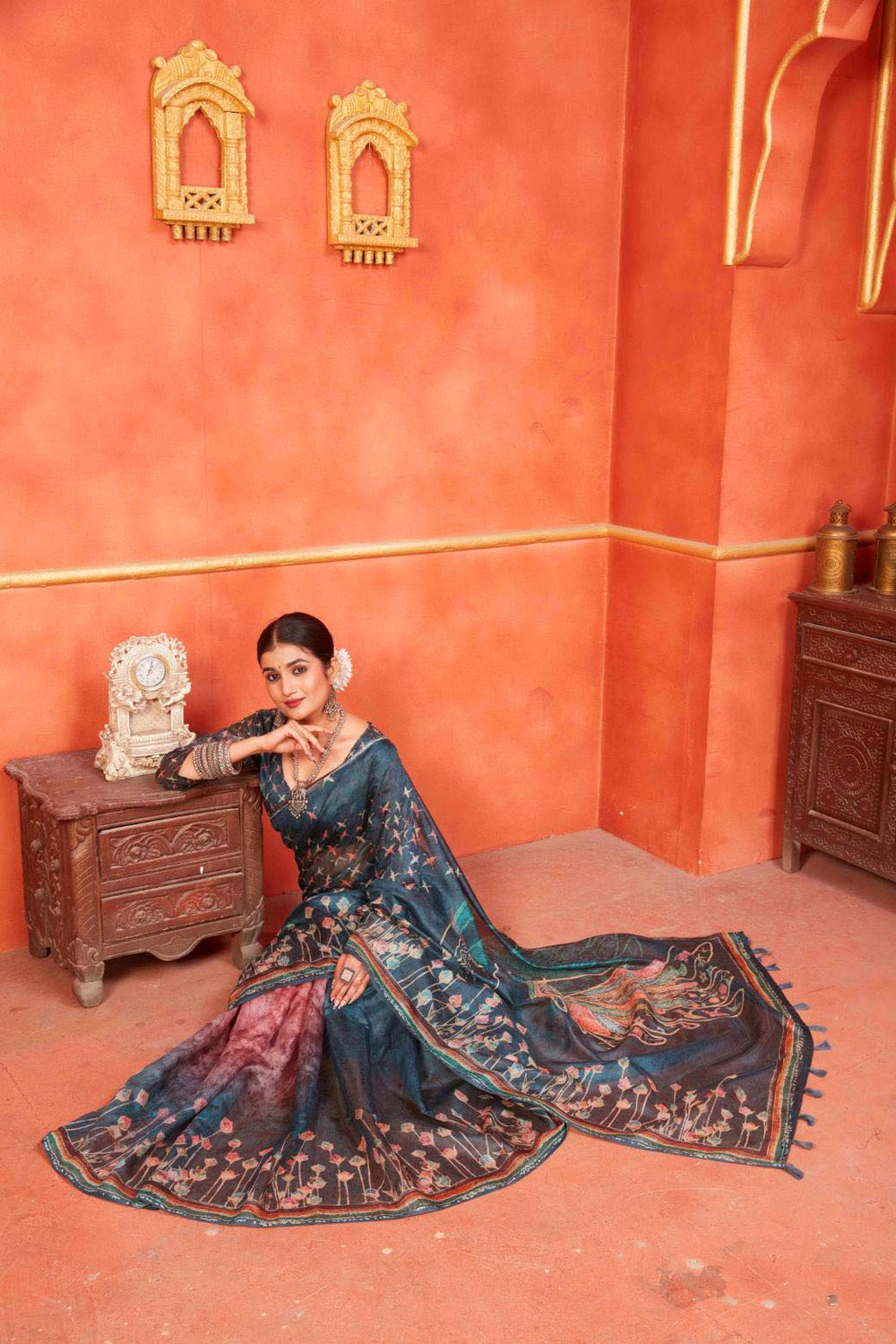 woman sitting in Indigo Designer Pichwai Chanderi Saree.