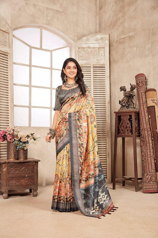 woman standing in Pastel Yellow Kalamkari diya saree.