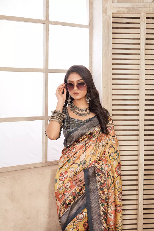 woman in Pastel Yellow Kalamkari diya saree.