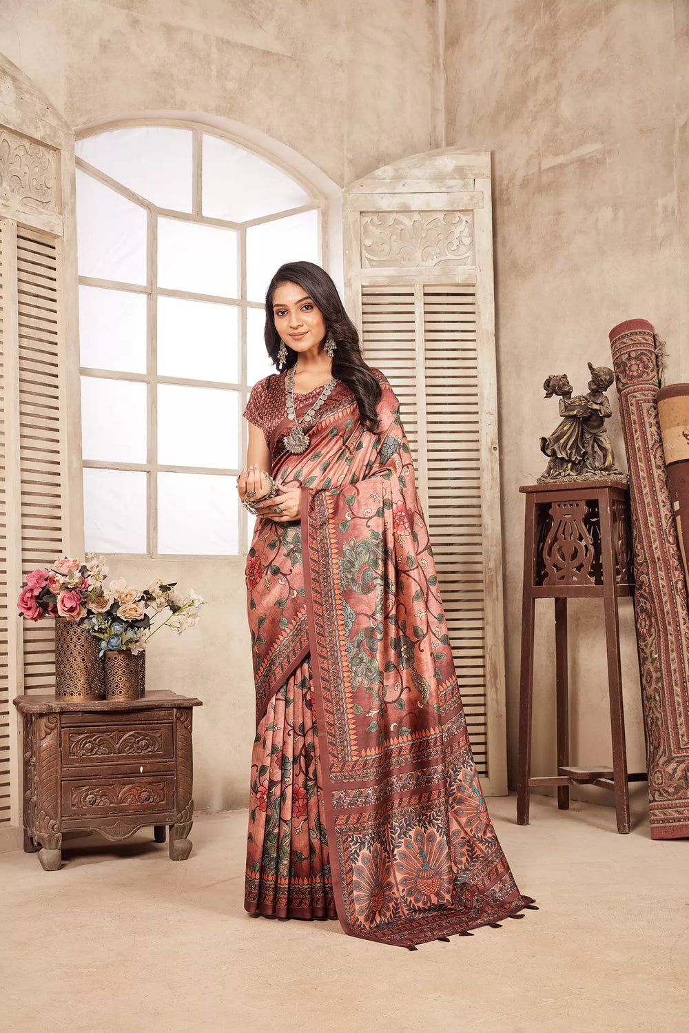 woman standing in Pistal Pink Kalamkari Figer Diya Saree.