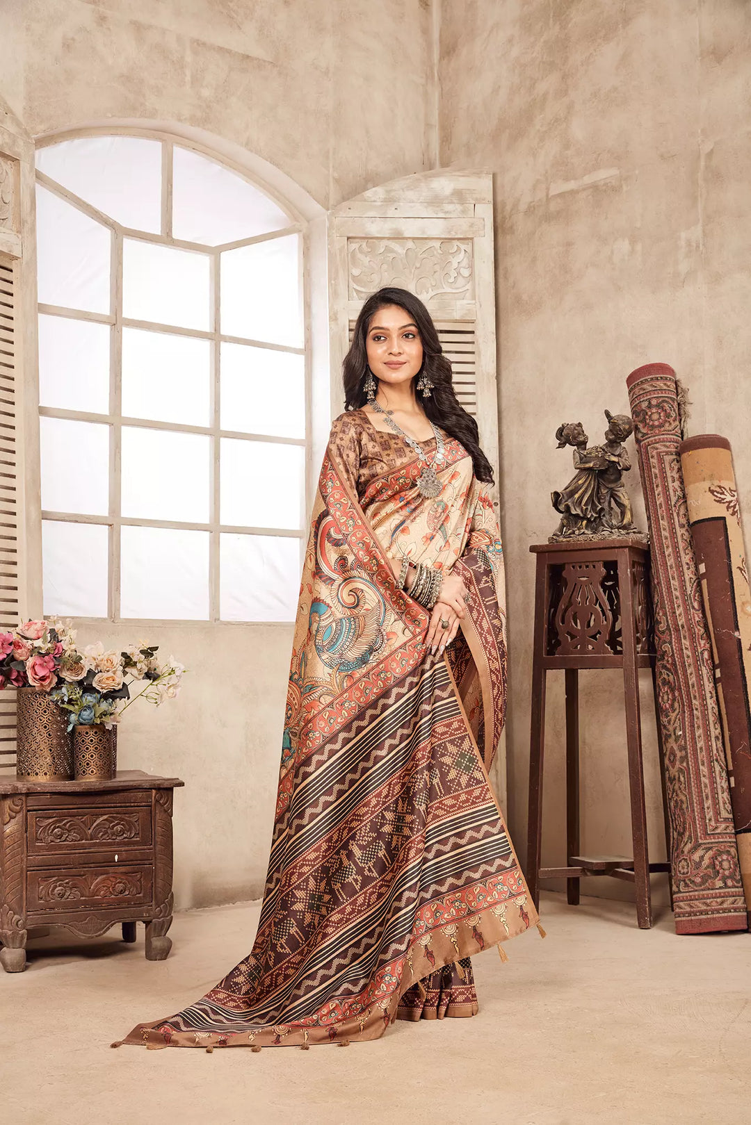 woman standing in Blue Peacock Kalamkari Diya Saree.