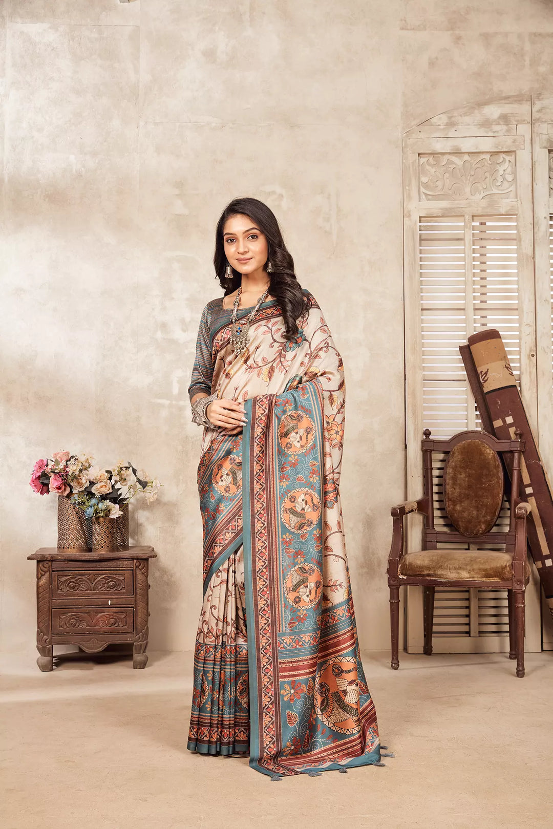 woman standing in Madhubani Kalamkari Diya Saree.