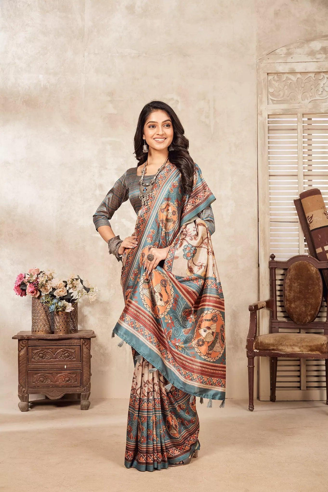 woman standing in Madhubani Kalamkari Diya Saree.