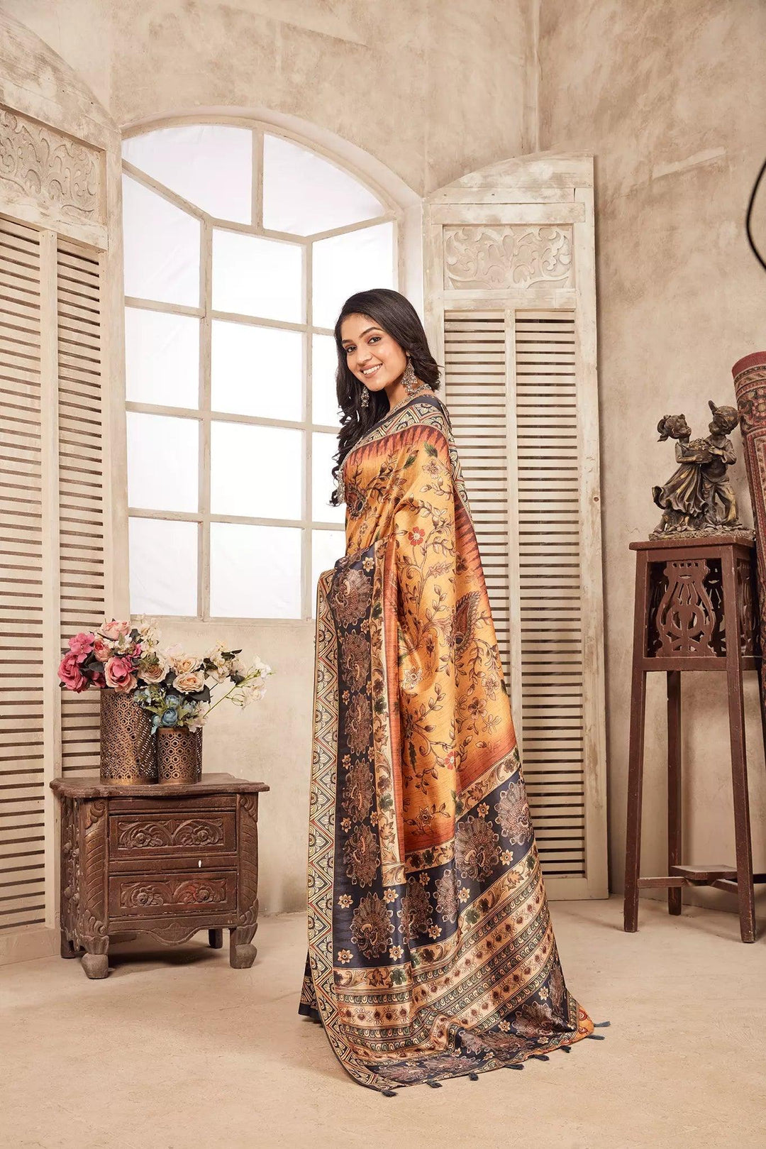 woman standing in Peacock Border Diya Saree.