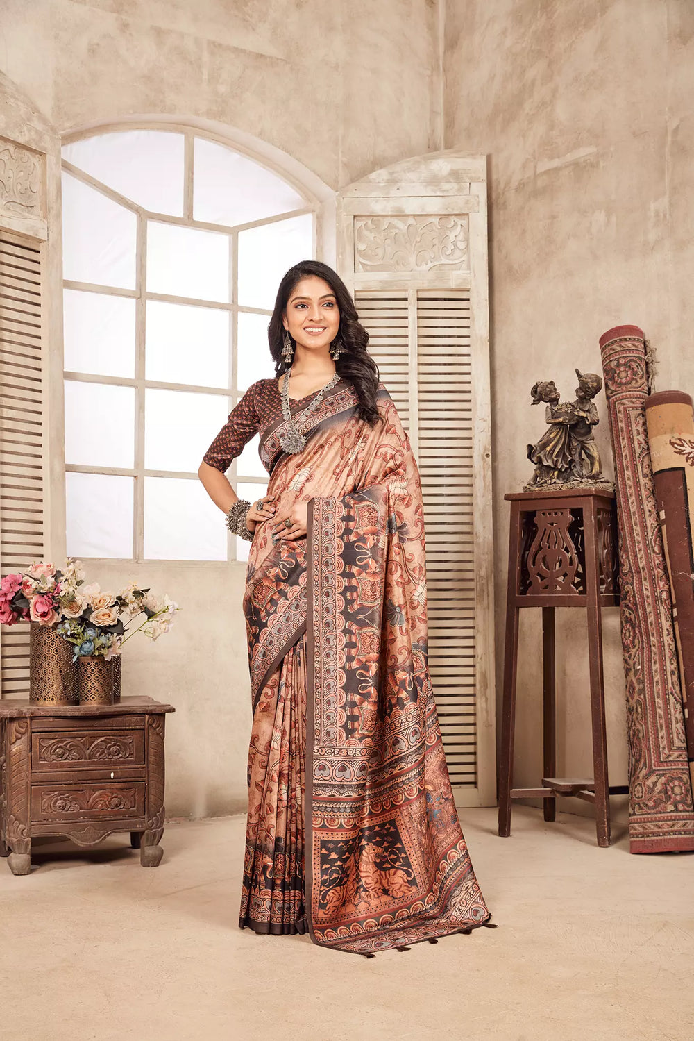 woman standing in Traditional Kalamkari Figer Diya Saree.