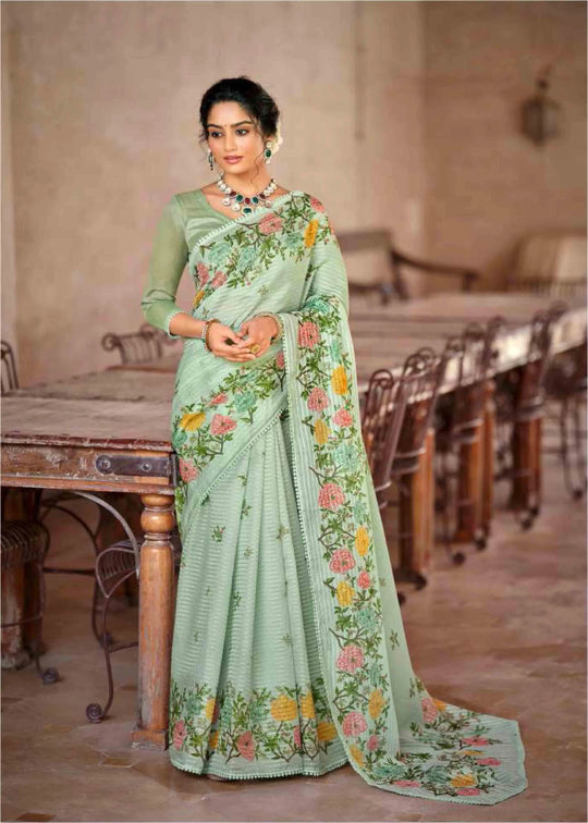 Woman in floral jal crochet saree standing near bench.