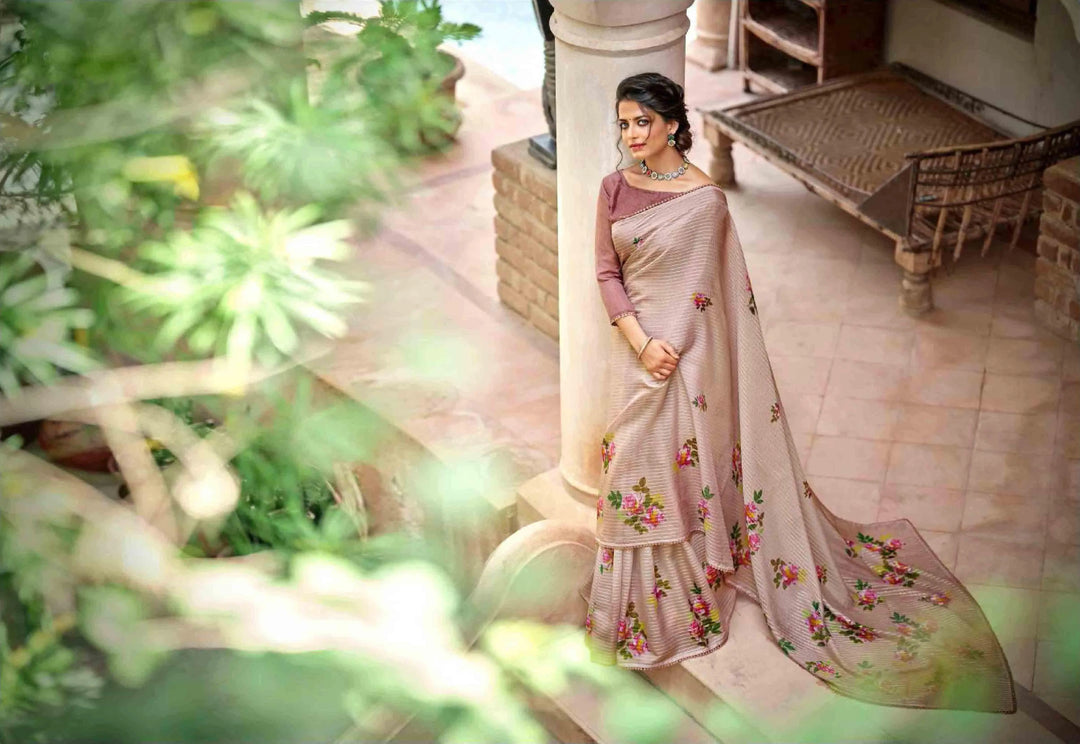 woman wearing a floral crochet saree, standing on a beautiful patio.