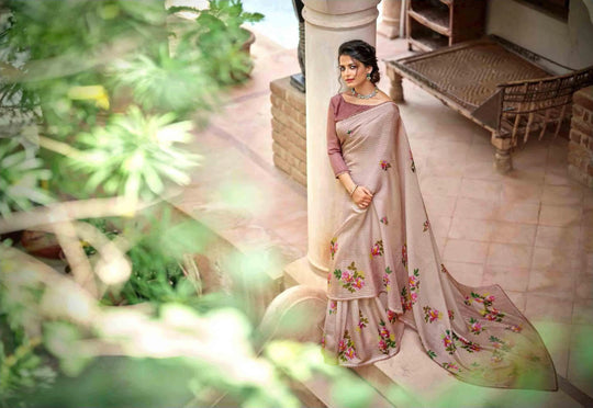 woman wearing a floral crochet saree, standing on a beautiful patio.