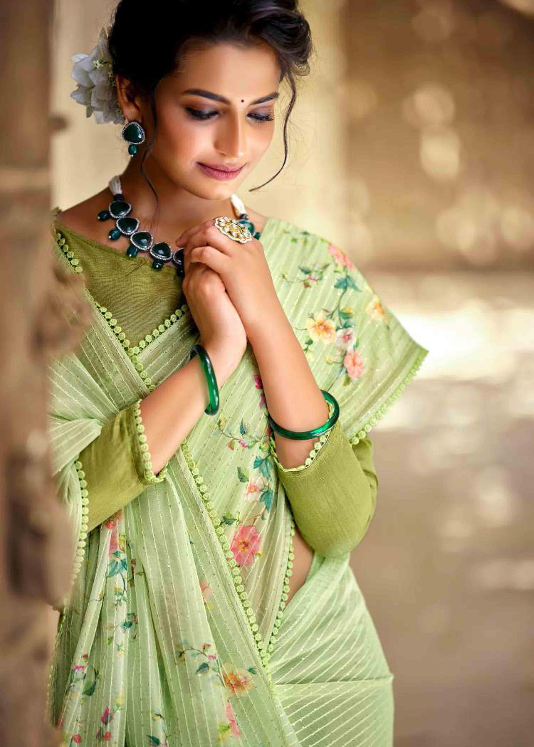 woman in light green floral crochet saree