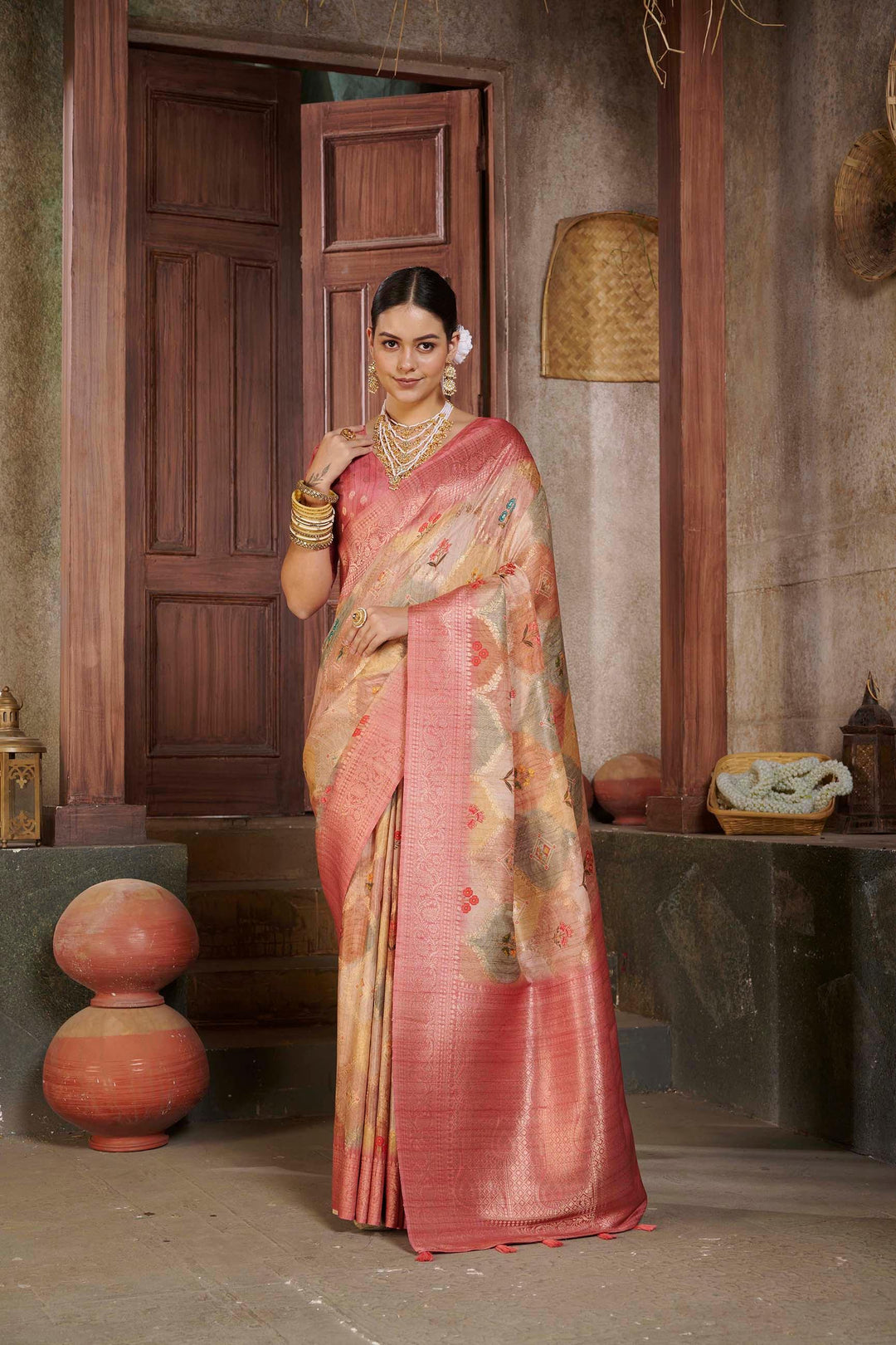 woman standing in Pink Jcrd Savannah Saree.